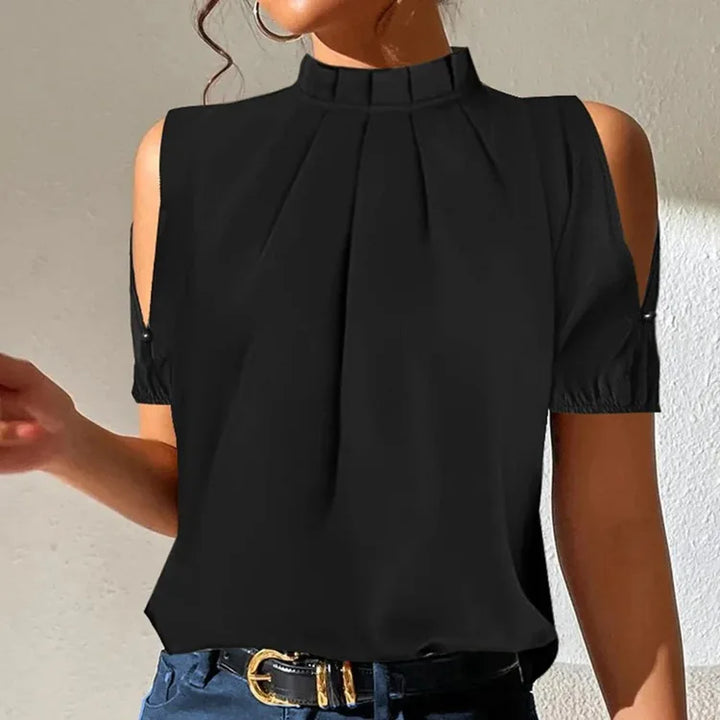Comfortable black pleated women's top for versatile styling, from casual outings to smart office attire. Modern fashion.