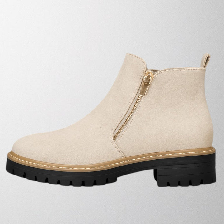 Stylish women's side zip shoes with a classic round toe, ideal for both professional and evening attire.