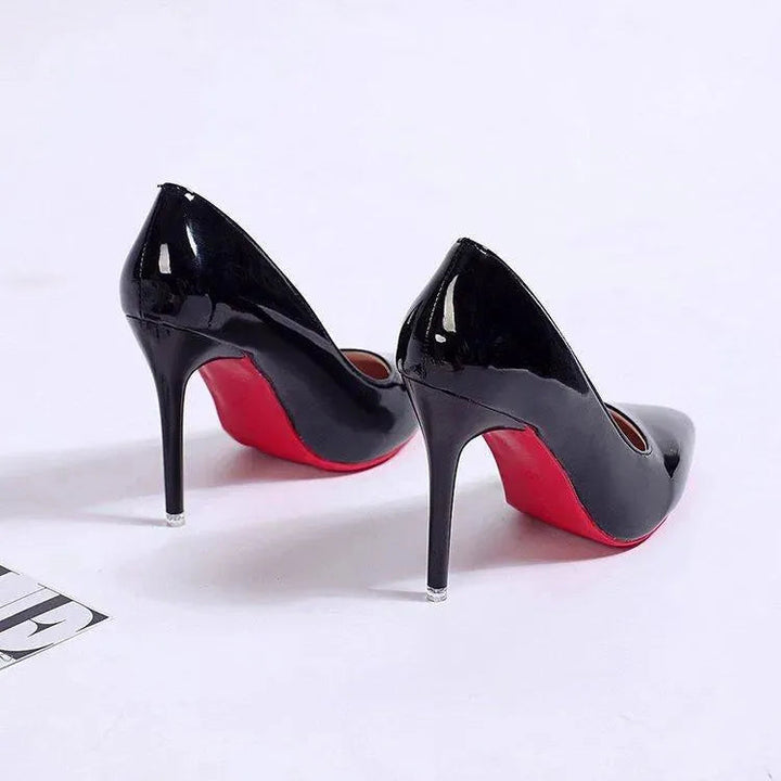 Black pointed-toe stiletto pumps, elegant women's high heels for parties & office wear.