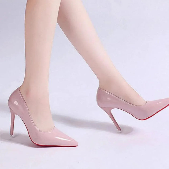 Formal women's stiletto pumps in black, elegant pointed-toe heels perfect for office & events.