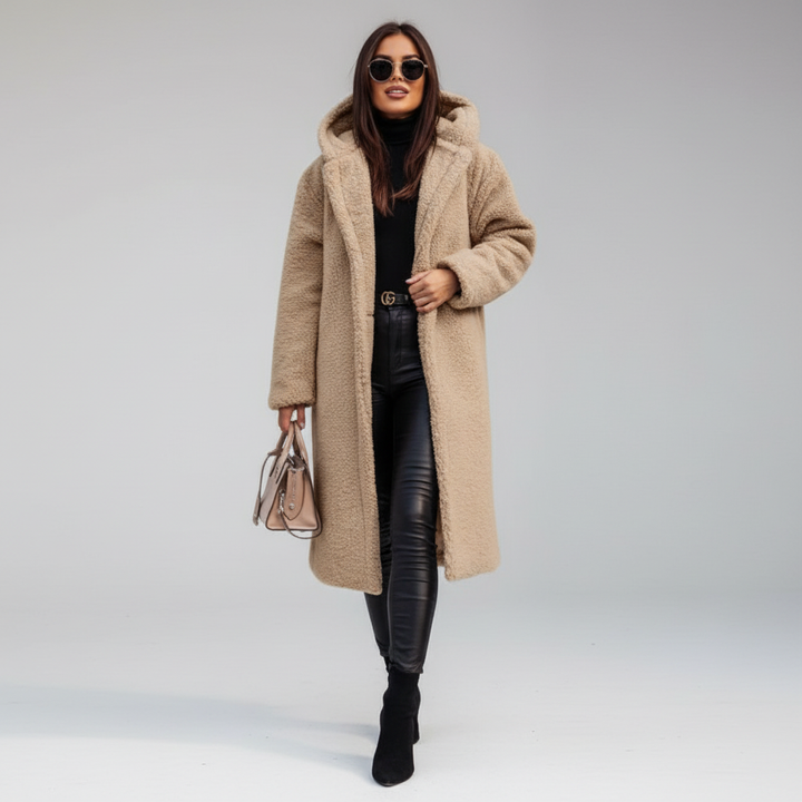 Stylish women's winter trench coat in neutral color with prominent button closure, fashion outerwear