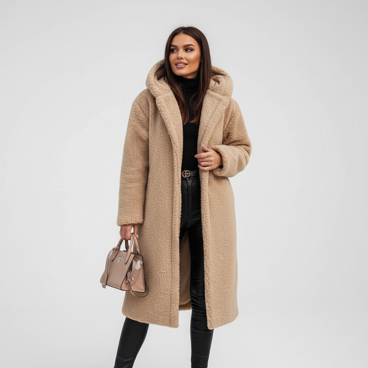 Full-body shot of a woman wearing a chic oversized trench coat, a must-have winter ladies' jacket