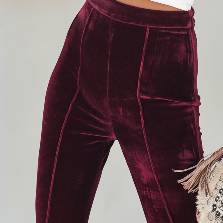 Luxurious women's velvet trousers, featuring a flattering flared leg and elastic waistband.
