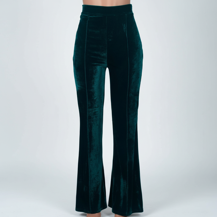 Full shot of women's comfortable high-quality velvet flared trousers, autumn winter apparel.