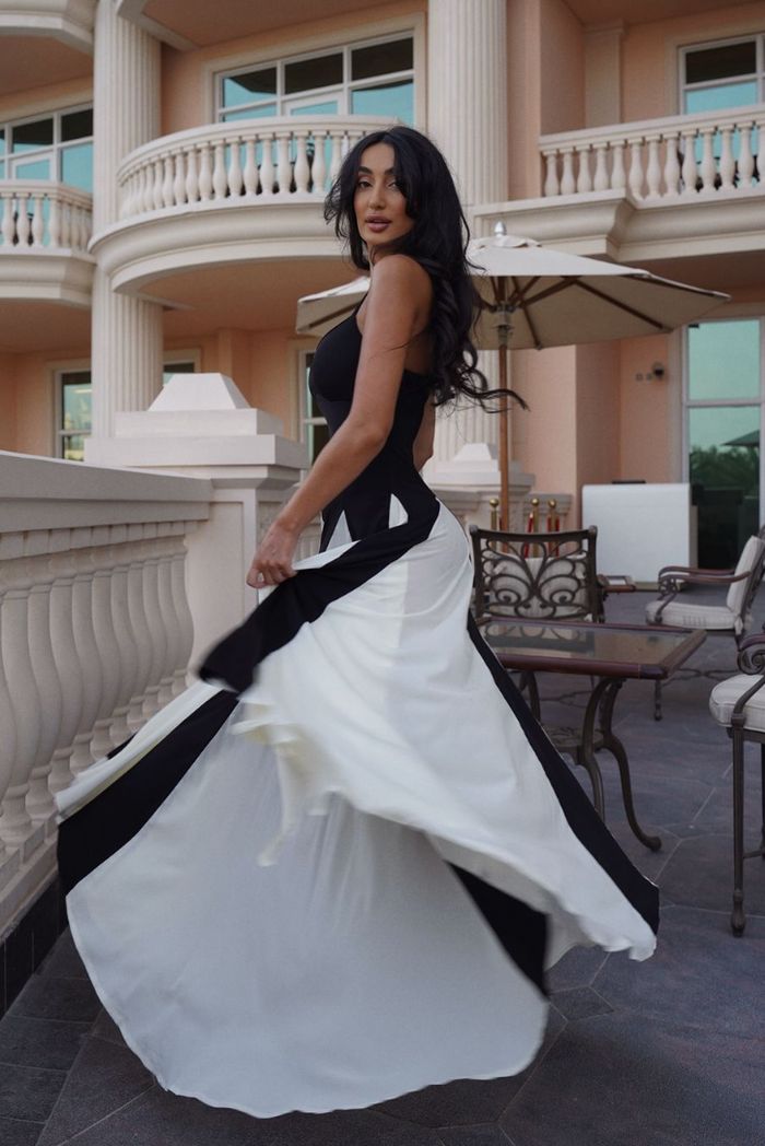 Chic Black & White Evening Maxi Dress for women. Elegant formal attire, perfect for wedding guests.