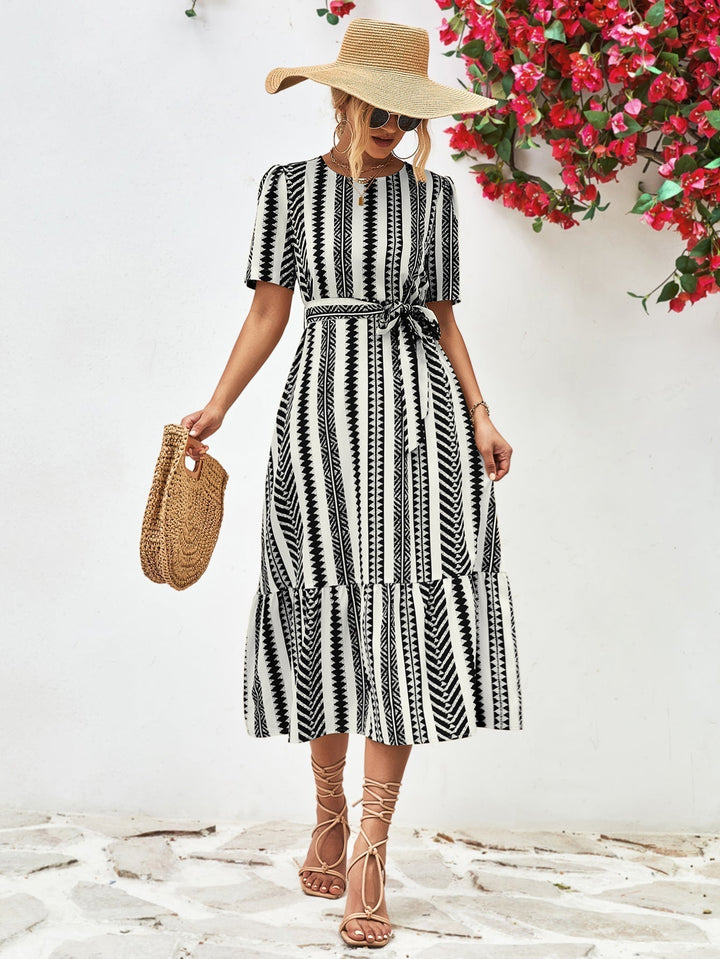 Elegant women's black & white striped midi dress with short sleeves, perfect for versatile classic style.