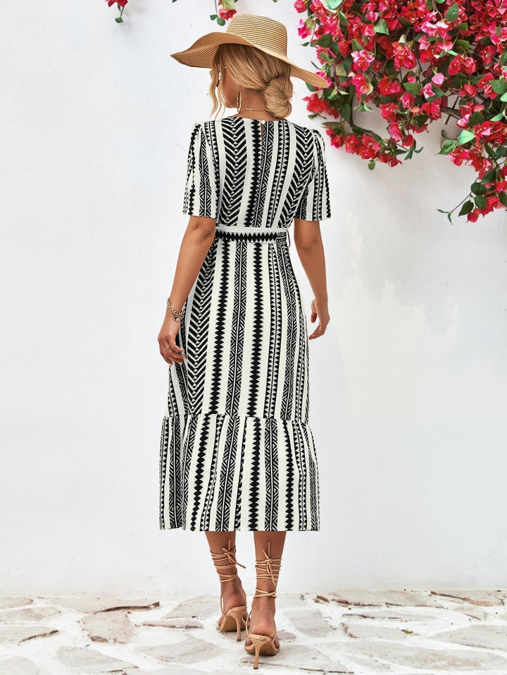 Classic black & white striped short-sleeve midi dress for women, a stylish and comfortable day dress.