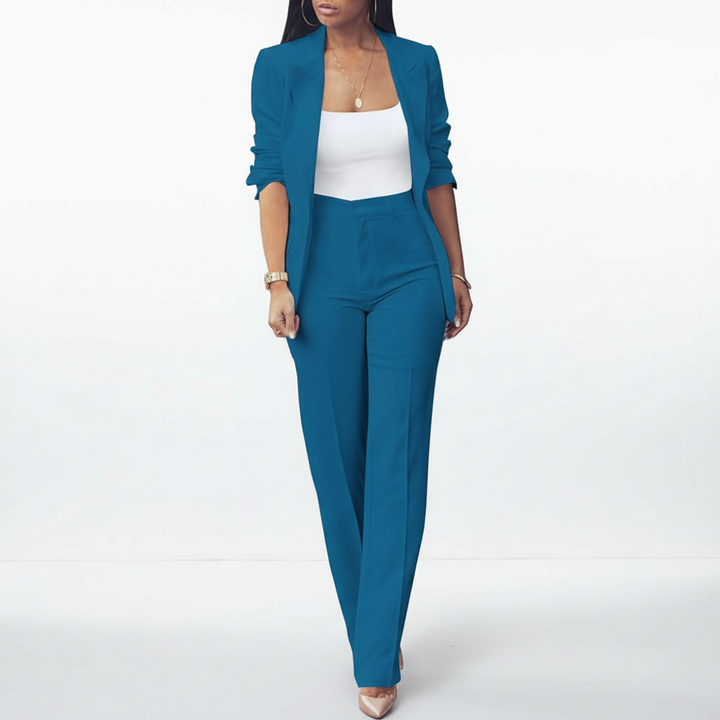 Chic women's matching blazer and pant set, versatile for office or elegant evening events.