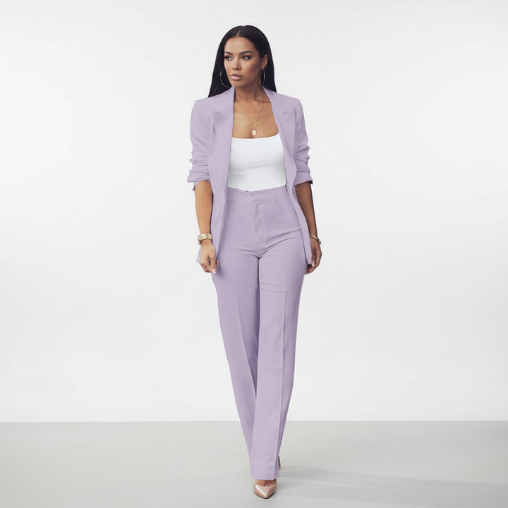 Modern women's pantsuit with a long-line blazer and flattering slim cut trousers.