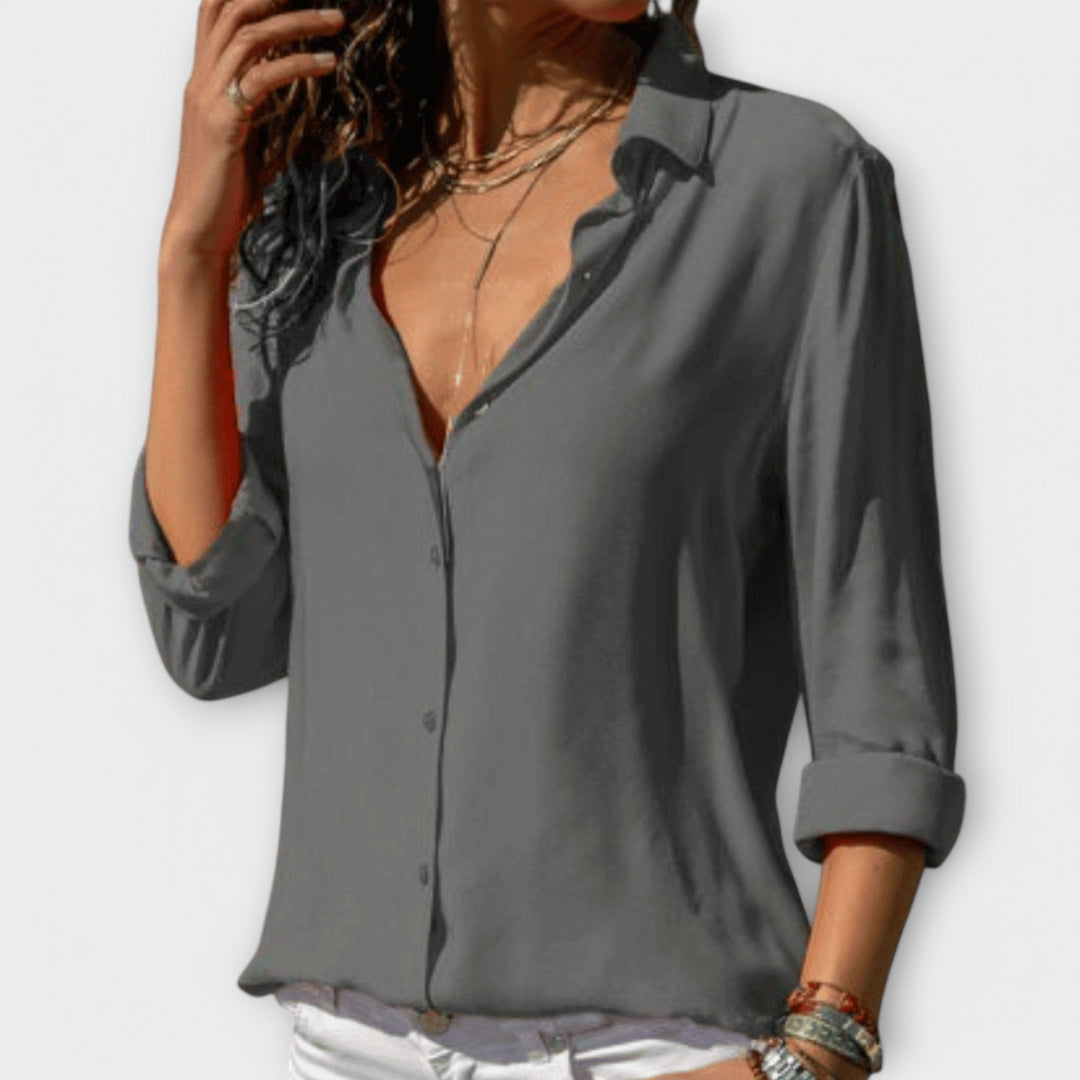 Classic women's office wear blouse. Elegant, versatile top for professional & evening looks.