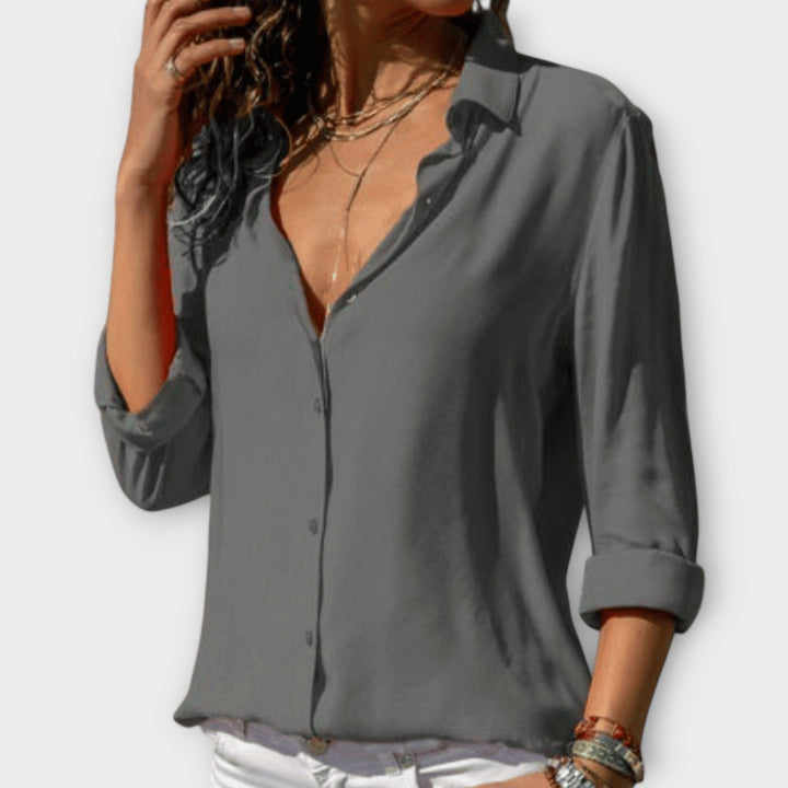Classic women's office wear blouse. Elegant, versatile top for professional & evening looks.