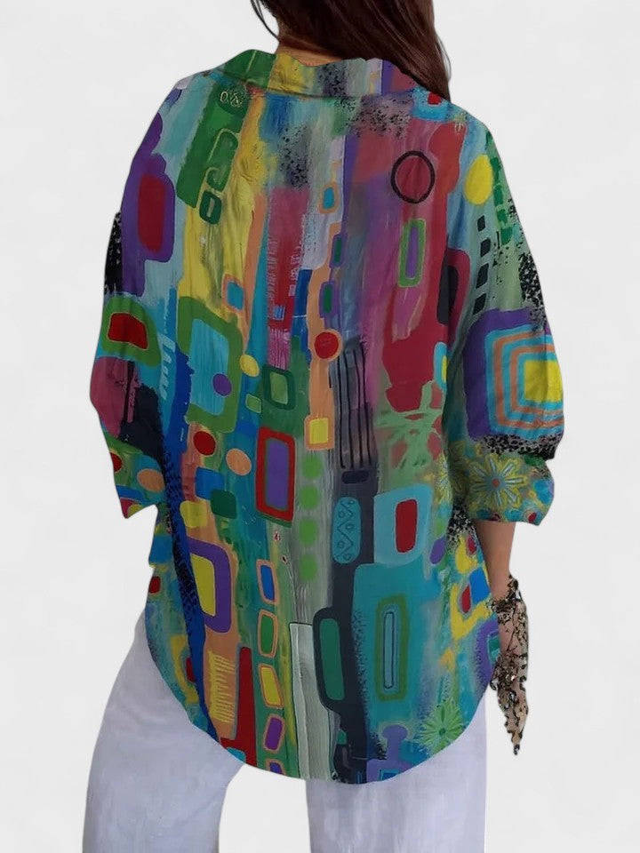 Chic women's blouse featuring a flattering geometric pattern. A versatile long sleeve top for both casual and dressy occasions.