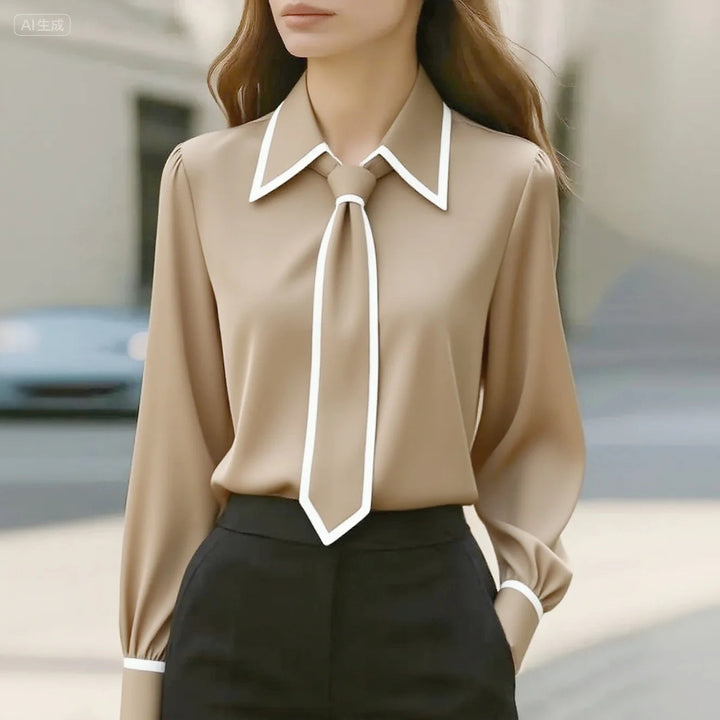 Women's elegant tie neck blouse, long sleeve. Features stylish contrast piping, ideal for office chic & formal wear.