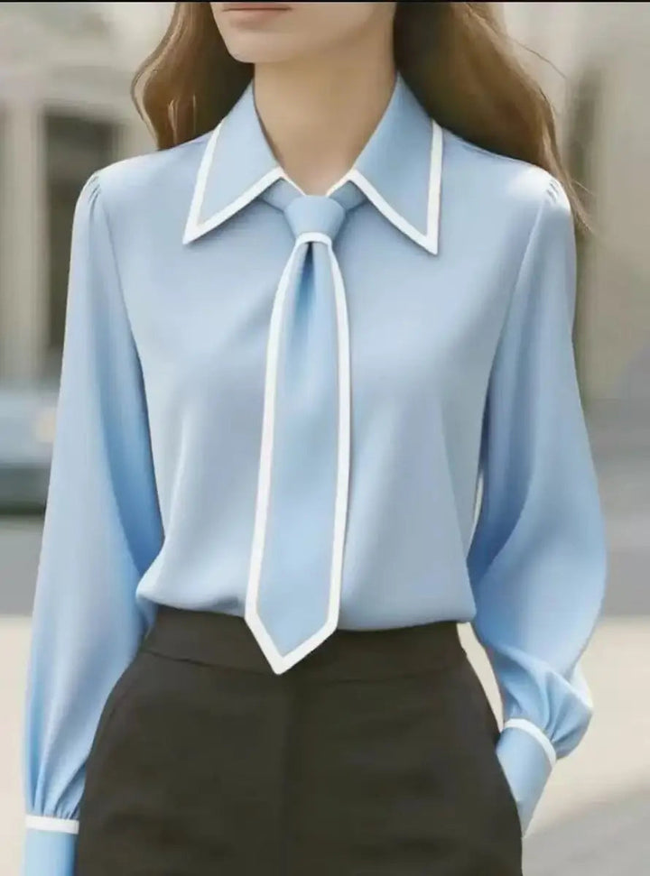 Sophisticated women's long sleeve blouse. Features an elegant oversized collar & contrast trim tie detail for workwear.