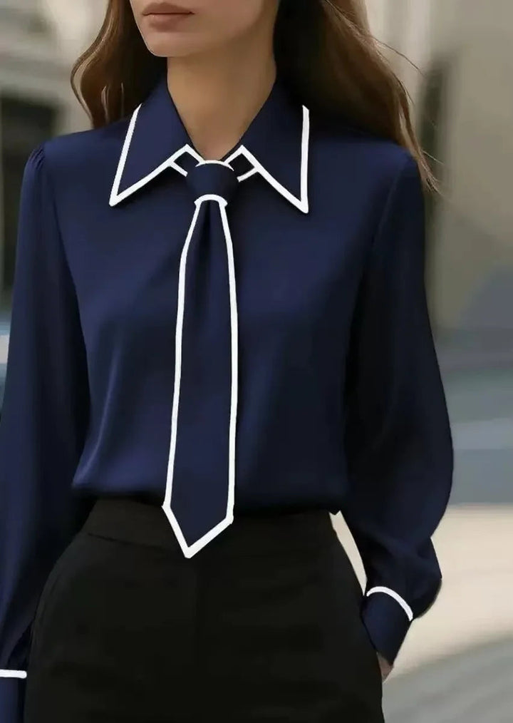 Versatile women's elegant blouse with contrast piping, tie neck, and long sleeves. Ideal for formal or smart casual.