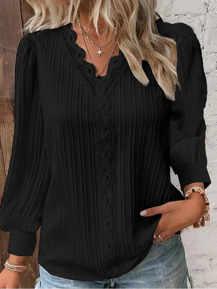 Elegant women's blouse with delicate lace accents and puff sleeves, perfect for chic spring/summer fashion.