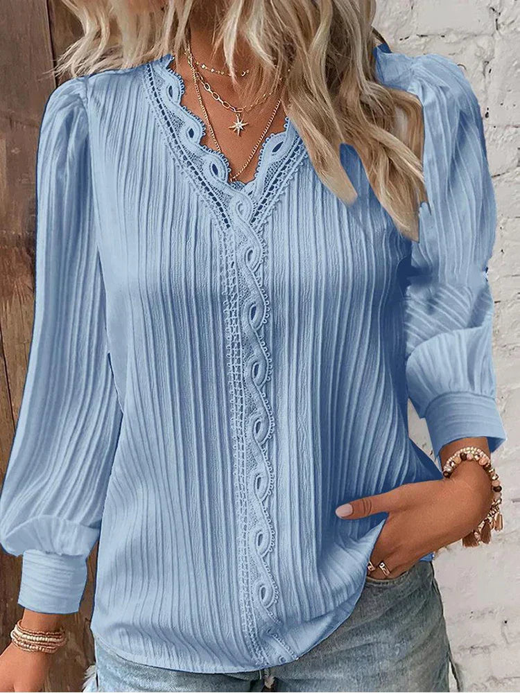 Chic women's relaxed fit blouse with delicate lace details, a versatile top for casual or elegant wear.