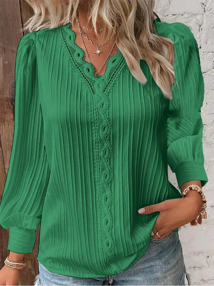 Fashionable women's elegant lace blouse, a stylish spring/summer top with a relaxed fit and delicate accents.