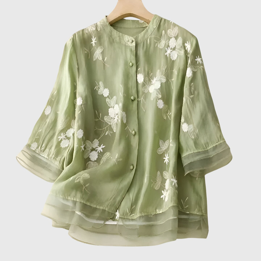 Versatile women's floral embroidered blouse, perfect for spring, offering an elegant relaxed fit for any occasion.