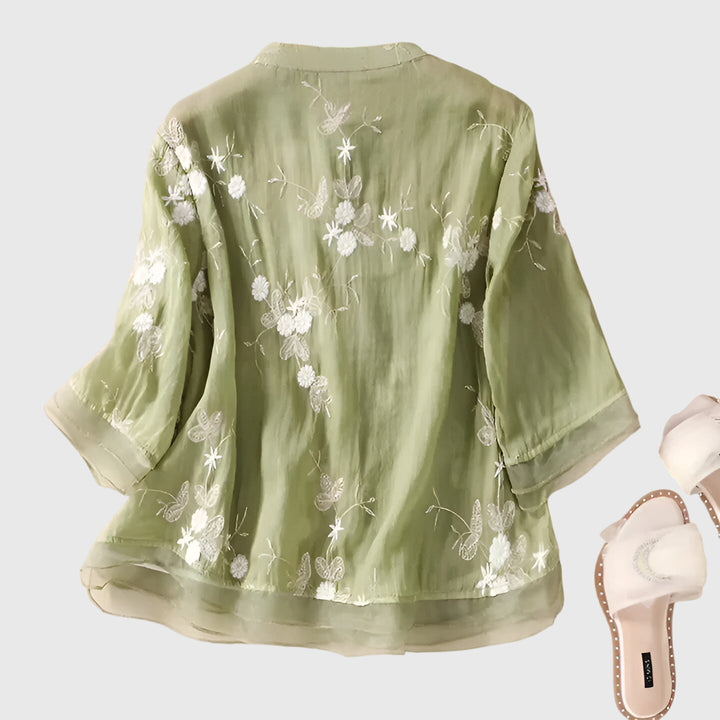Comfortable women's relaxed fit blouse with beautiful floral embroidery, ideal for casual chic or special occasions.