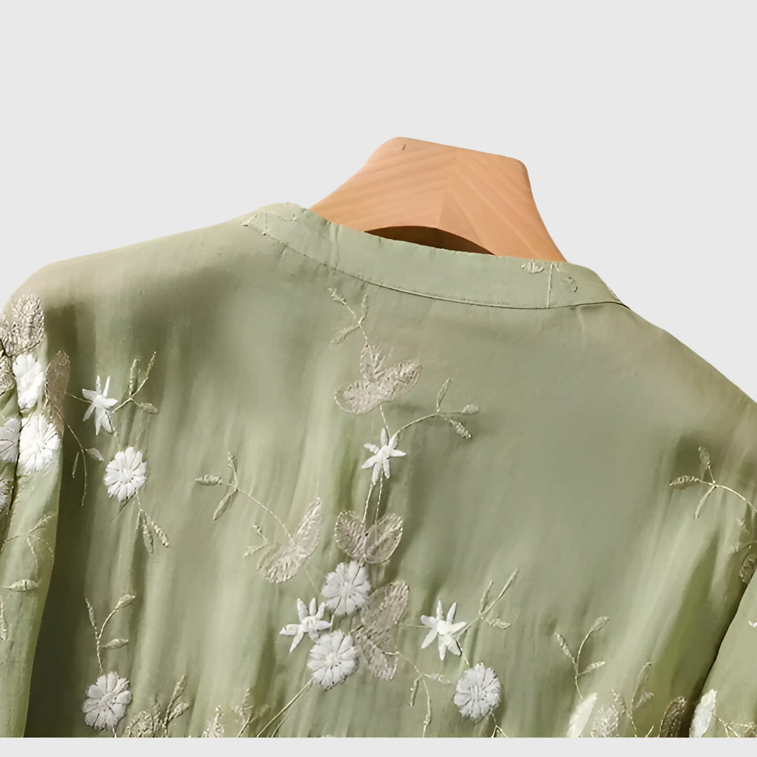 Stylish women's top showcasing delicate floral embroidery & a relaxed fit, perfect for comfortable fashion.