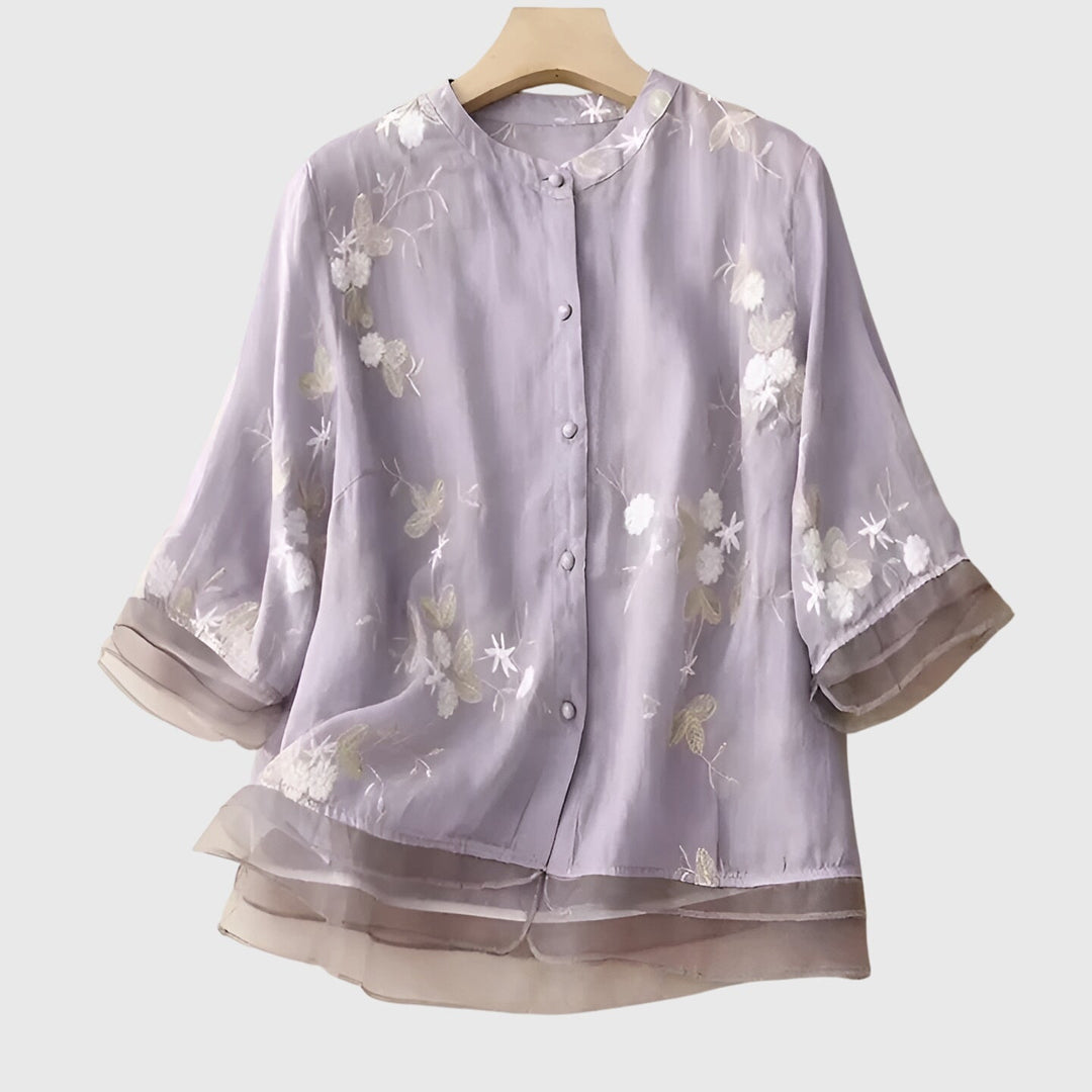 Fashionable women's floral embroidered blouse, a relaxed fit top for elegant everyday wear & spring style.
