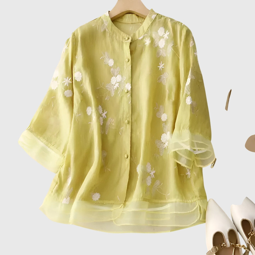 Women's elegant floral embroidered blouse with a relaxed fit, a comfortable & stylish top for versatile wear.