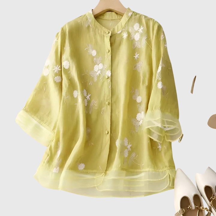 Women's elegant floral embroidered blouse with a relaxed fit, a comfortable & stylish top for versatile wear.
