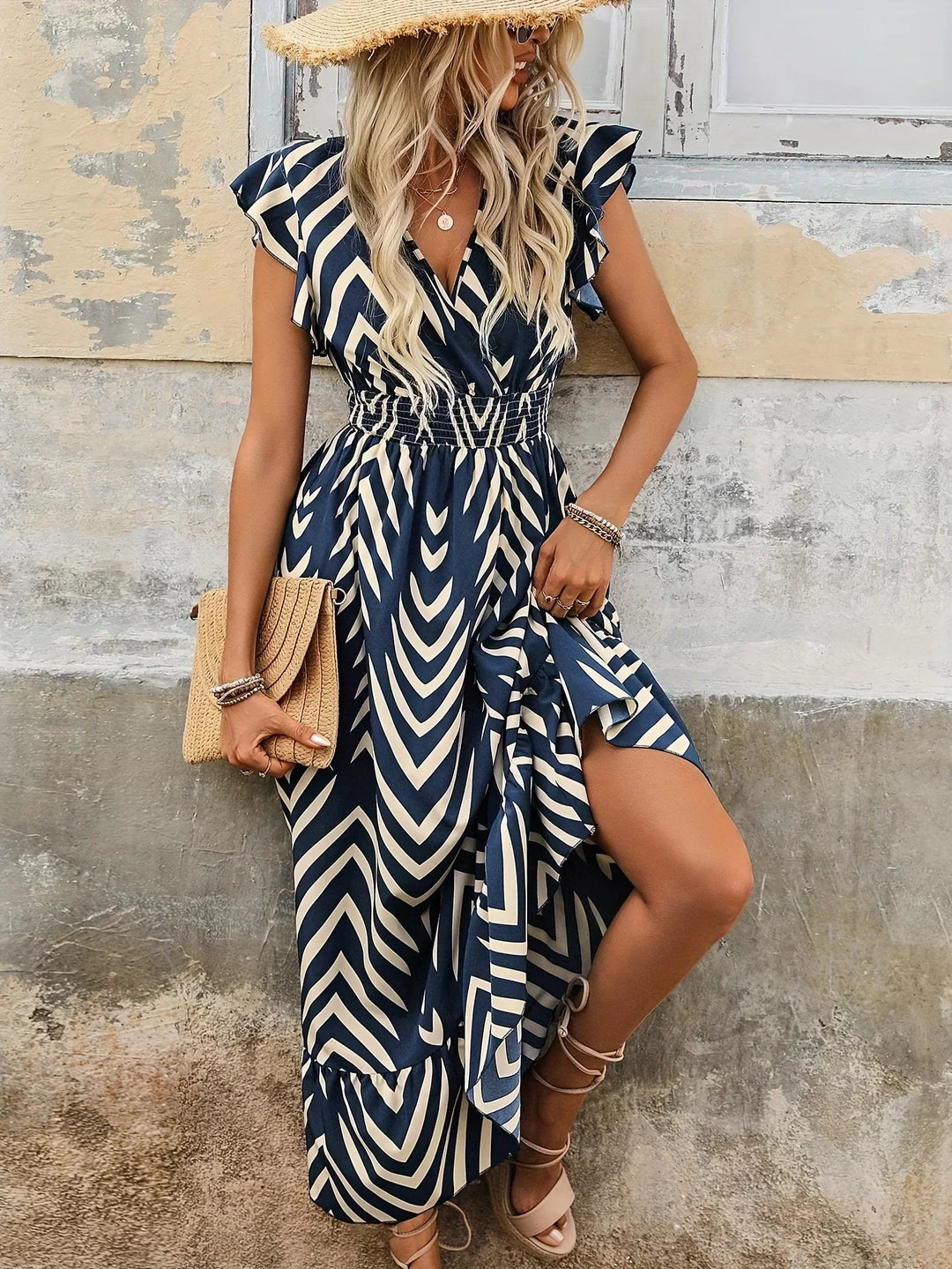 Elegant women's blue print midi dress with a flattering twisted waist. Perfect for chic day-to-night style.