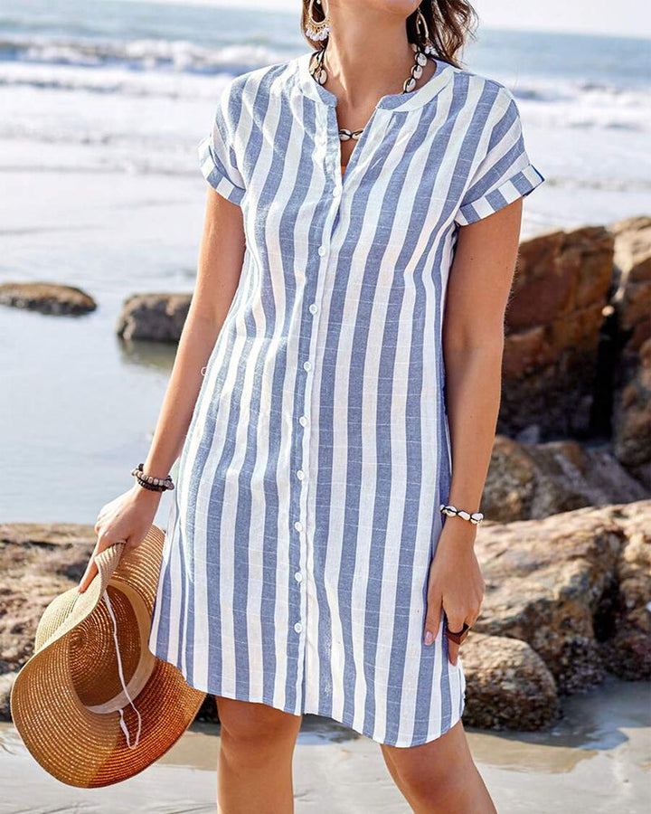 Elegant women's blue striped shirt dress with V-neck, a versatile outfit perfect for office wear or casual chic day fashion.