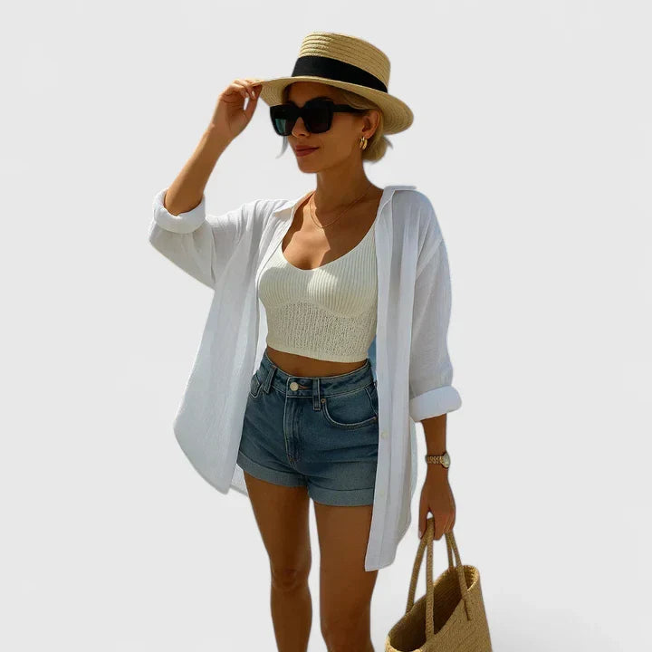 Elegant women's bohemian blouse with long sleeves, relaxed fit, and unique back detail. Perfect for summer chic fashion.