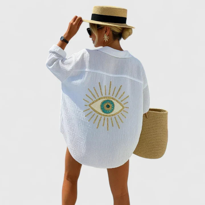 Chic bohemian blouse for women, featuring intricate embroidery, sequin, and pearl accents on a unique back detail.