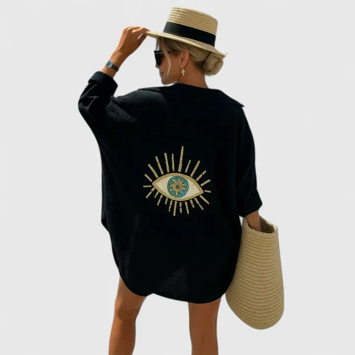 Versatile women's bohemian long sleeve blouse. Relaxed fit, elegant embroidery, and unique back detail for casual elegance.