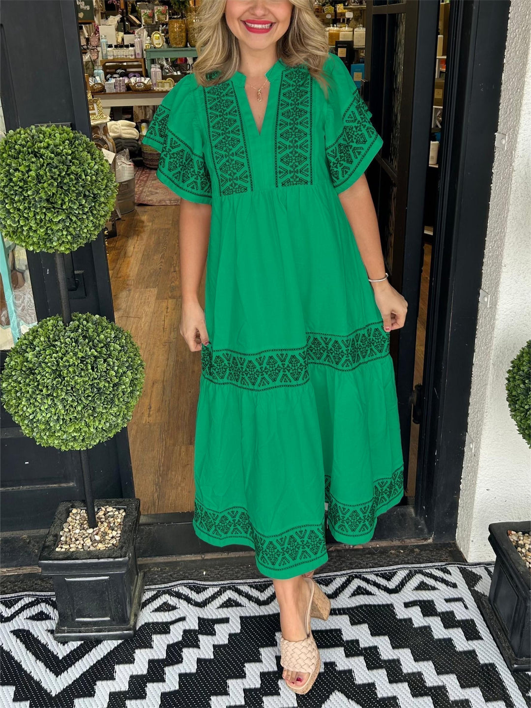Woman wearing elegant boho midi dress. A-line cut, perfect for comfortable summer outings & stylish spring fashion.