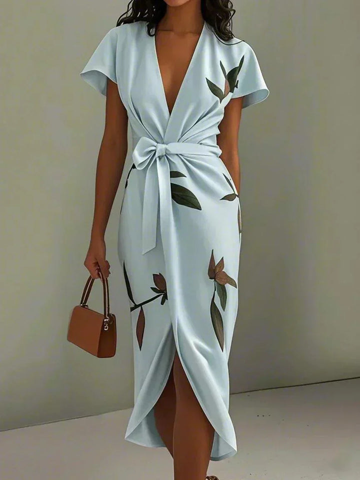 Stylish botanical floral midi dress for women, featuring a flattering V-neck, flutter sleeves & a chic bow-tie, ideal for special occasions.