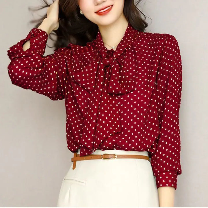Red ladies' bow shirt with a sophisticated shawl collar, a versatile and elegant top for any occasion.