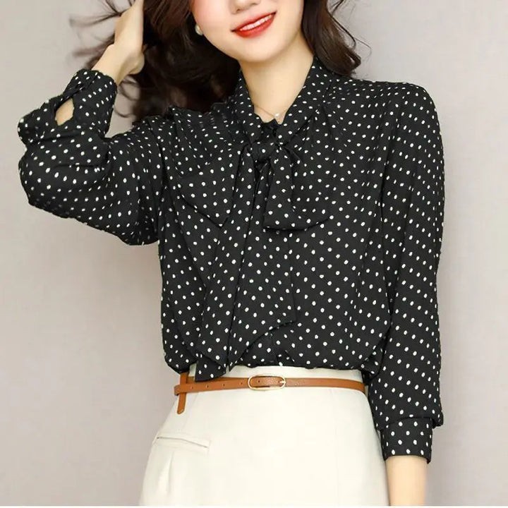 Apricot versatile women's bow blouse with an elegant shawl collar, perfect for stylish ladies' fashion.