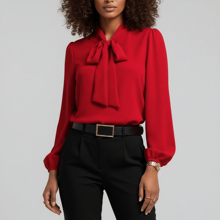 Elegant women's bow tie neck blouse with puff sleeves, ideal for office or business casual style.