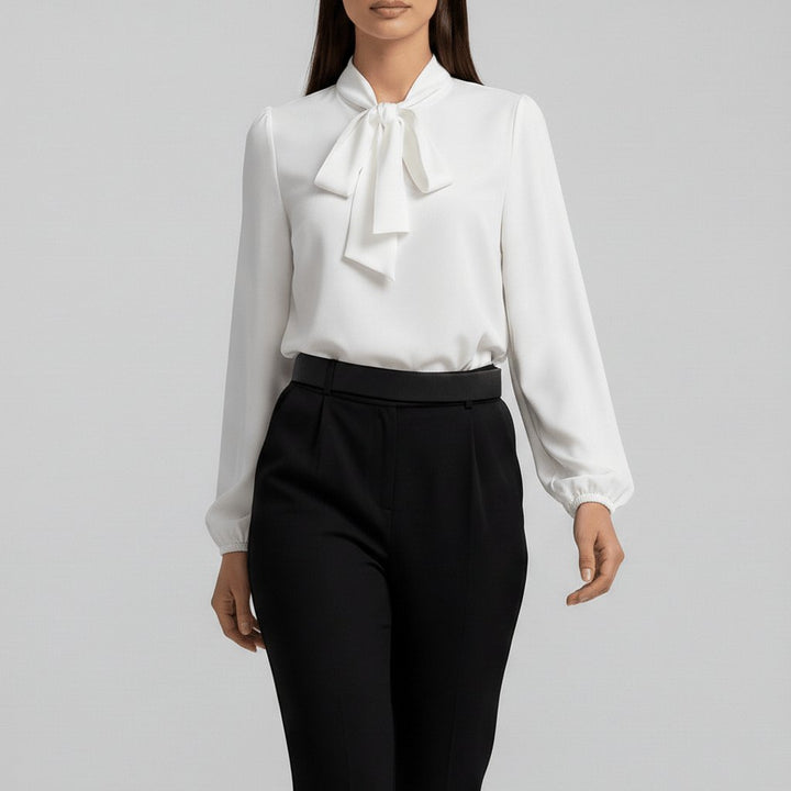 Sophisticated women's long sleeve blouse, featuring a stylish bow tie neck and elegant puff sleeves.