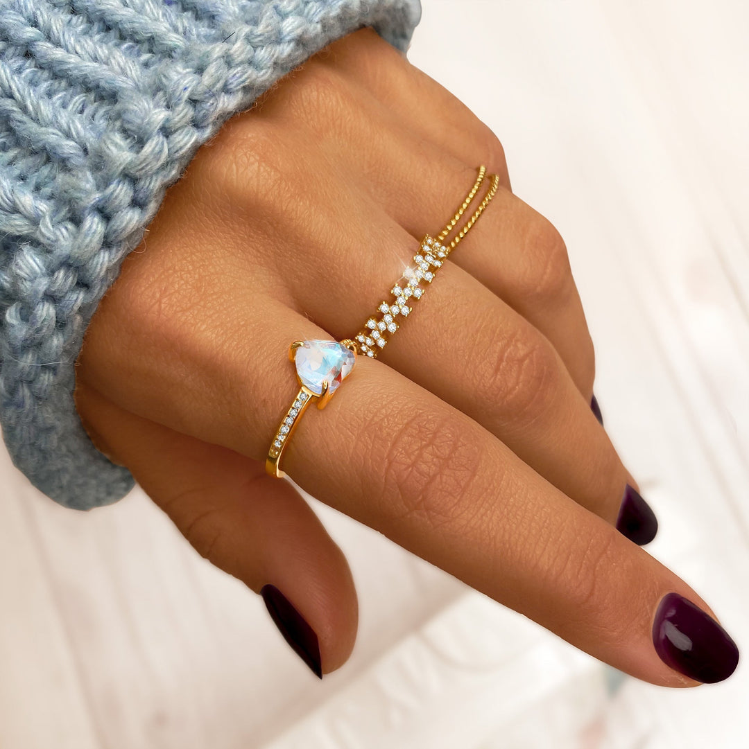 Close-up of a women's braided double ring, combining sterling silver & gold plated intricate design, a stylish accessory.