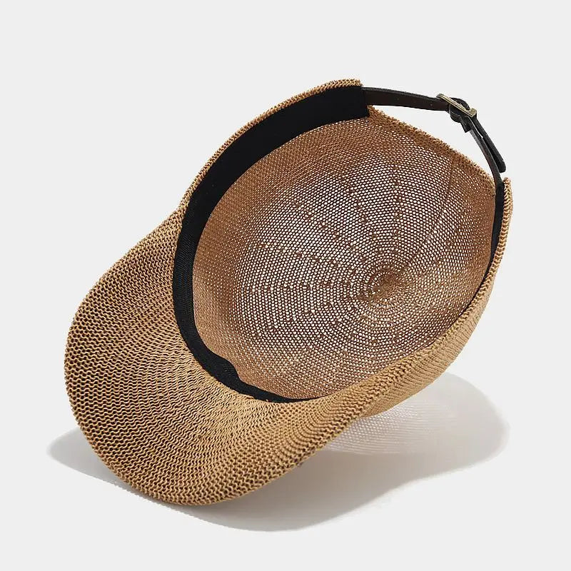 Trend-setting women's braided sun hat with wide brim, a must-have fashion accessory for UV protection.