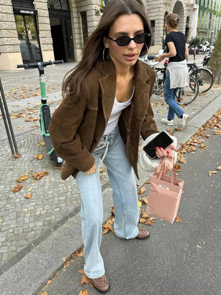 Sophisticated women's brown suede jacket; a versatile long-sleeve piece for elegant office wear or casual chic.