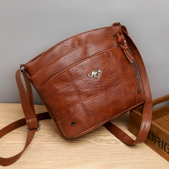 Elegant women's brown vegan leather shoulder bag, perfect for daily use & office. Chic & versatile handbag.