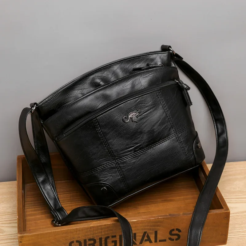 Sabrina elegant women's vegan leather shoulder bag in black. Chic handbag for office & daily versatile style.