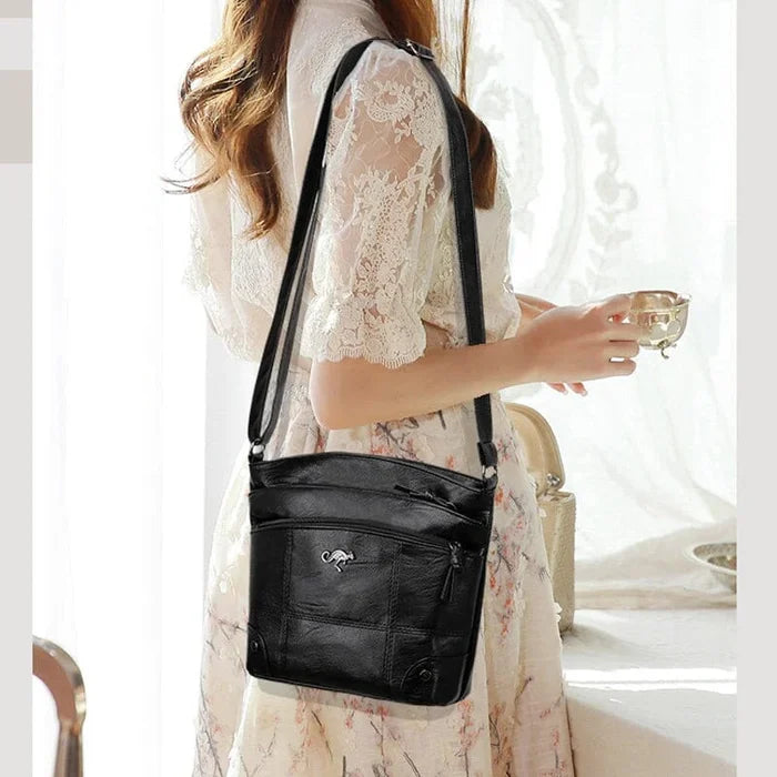 Versatile women's black vegan leather shoulder bag. Ideal elegant handbag for daily errands, work, or evenings out.