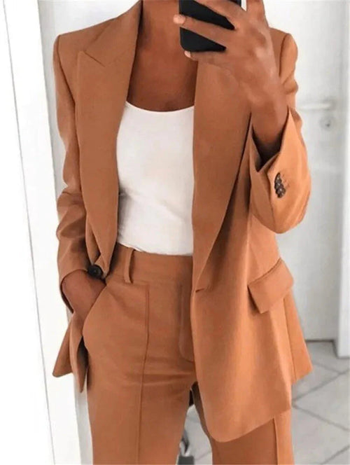 Elegant women's business pant suit with a tailored blazer, perfect for professional office wear.