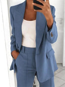 Professional women's business suit, a chic blazer and pant set ideal for office and formal events.
