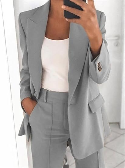 Tailored women's pant suit, featuring an elegant blazer & matching trousers for a sophisticated business look.