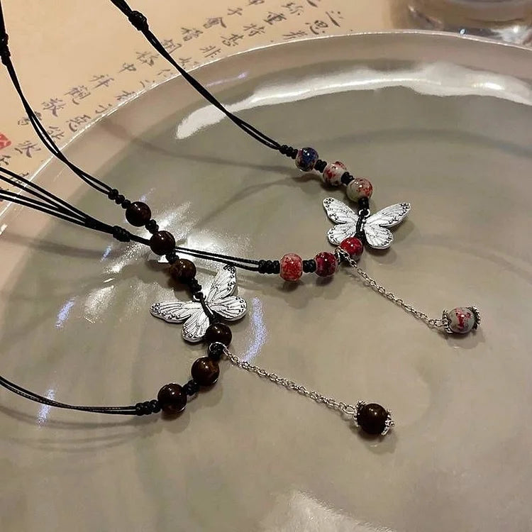 Versatile women's necklace: graceful butterfly & lustrous pearl. Elegant jewelry, perfect delicate gift for her.