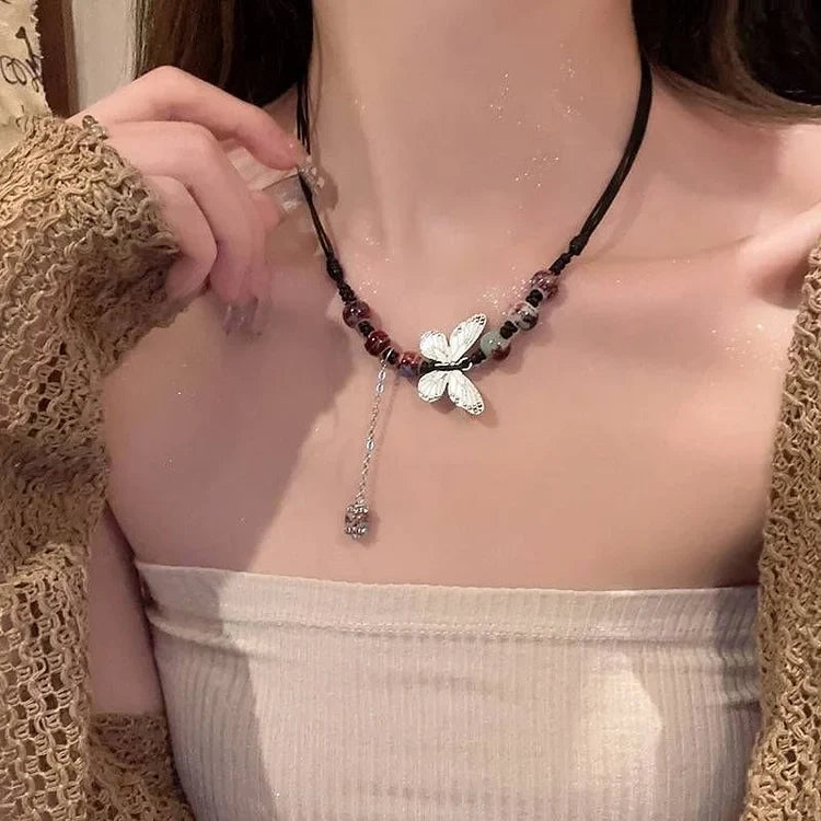 Delicate pearl & butterfly necklace for women. Elegant fashion accessory, a beautiful and versatile gift.